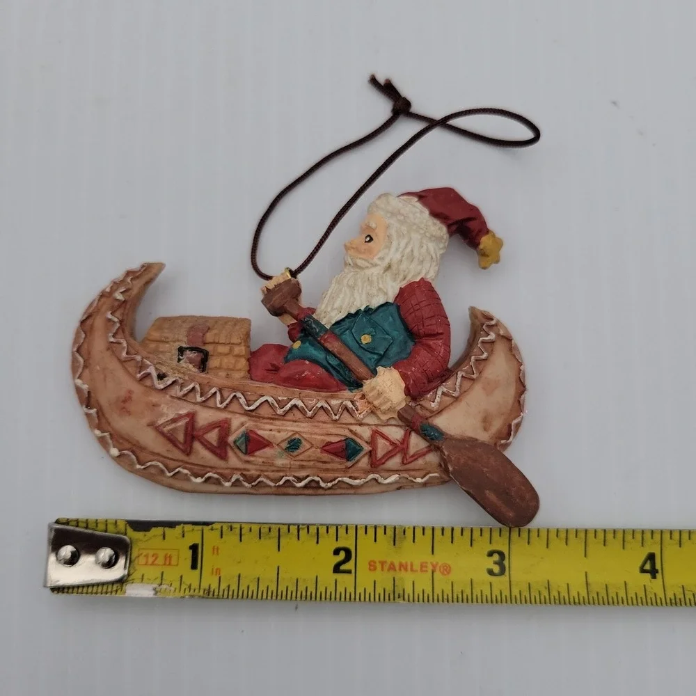 Kurt Adler Santa Claus Paddling Canoe Folk Art Christmas Ornament Resin Vintage